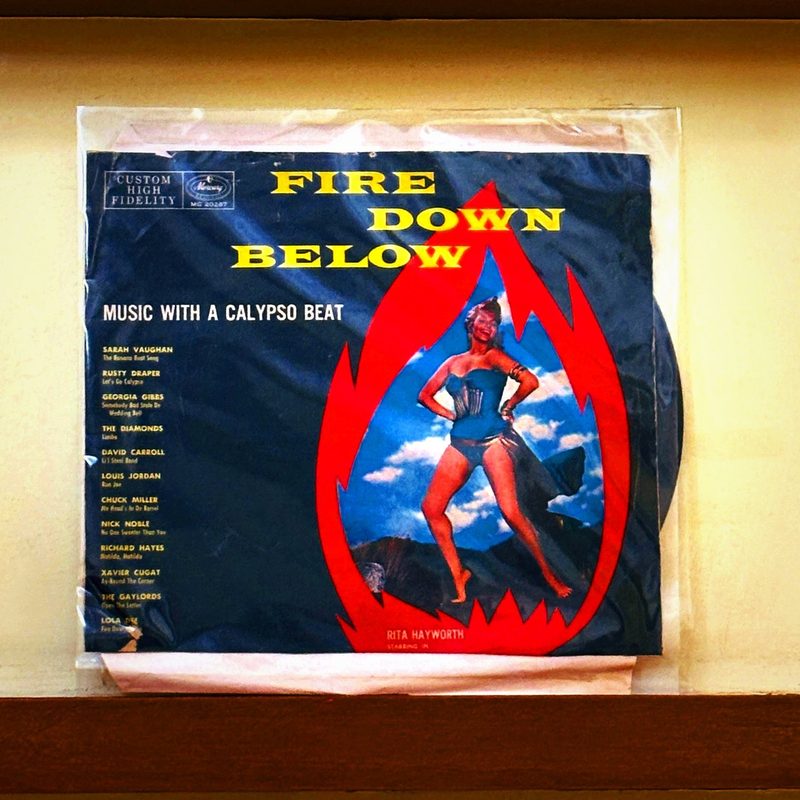 Various Artists (Sarah Vaughan, Rusty Draper, Georgia Gibbs, The Diamonds, David Carroll, Louis Jordan, Chuck Miller, Nick Noble, Richard Hayes, Xavier Cugat, The Gaylords, Lola Dee) — Fire Down Below: Music with a Calypso Beat (Front)